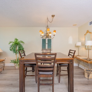 Gather around the stylish dining table, where you can share stories and laughter while enjoying the coastal vibe