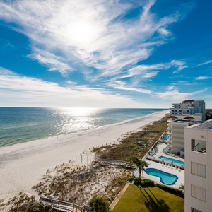 Experience seemingly endless coastline views of the horizon as waves lap the shore and the sun glistens over the water