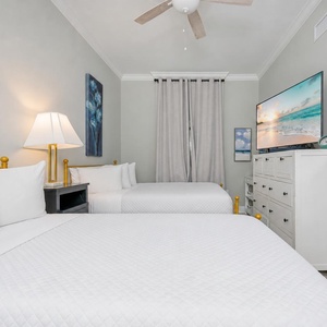 Relax on one of the cozy queen beds in this guest suite and enjoy a restful retreat