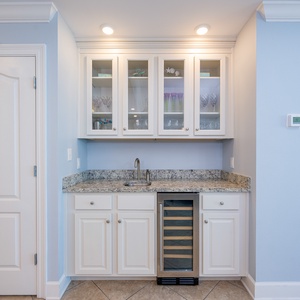 A wet bar with granite counters and a wine cooler awaits your favorite drinks while you unwind