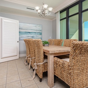 Gather around the rustic dining table, savoring the coastal vibe while making memories with loved ones