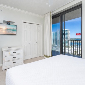 Guest suite with a queen bed invites you to unwind while you watch a favorite show on the wall TV