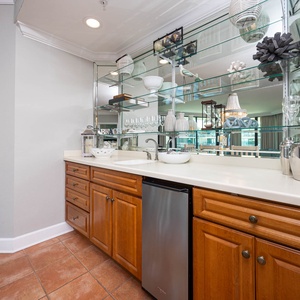 Mix drinks at the stylish wet bar while enjoying the lively atmosphere and elegant decor around you