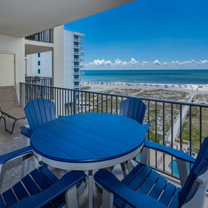 Enjoy the stunning views of the beach and the tranquil gulf waters from the patio set