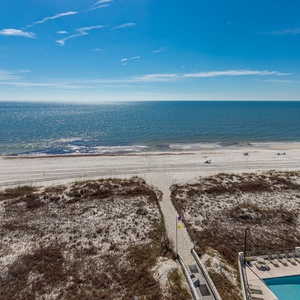 Enjoy stunning beachfront views from this inviting space, perfect for relaxation and unwinding by the pool