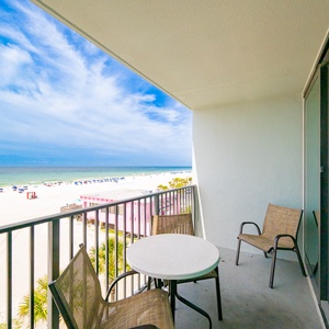 Relax on the balcony enjoying the bright sun and expansive views of the tranquil waters