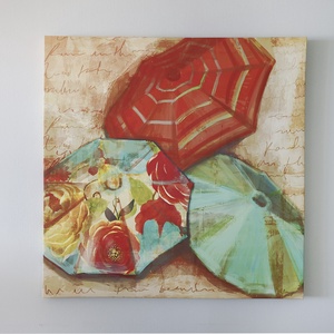 This vibrant artwork featuring colorful beach umbrellas adds a cheerful touch to the room's decor