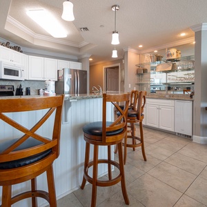 Wake up with morning coffee at the breakfast bar and get ready for a beach day in this stylish space