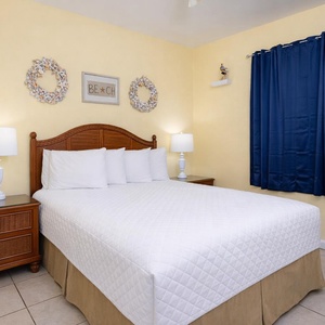 Relax on the plush king in the bedroom as you recharge for a day of fun along the coast in this welcoming suite