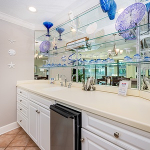 Grab a chilled drink from the fridge or create your favorite cocktail at the wet bar