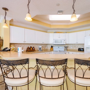 Experience the joy of preparing snacks at the breakfast bar while enjoying the vibrant kitchen vibe