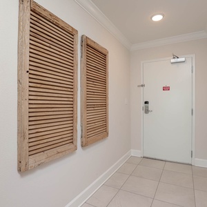 Step into a welcoming entryway adorned with unique decor, inviting you to begin your beach getaway
