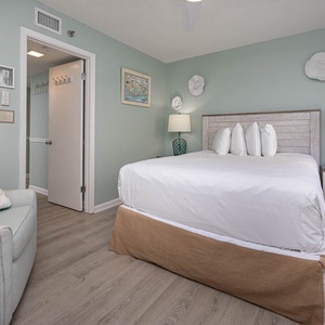 Unwind in the tranquil guest bedroom featuring a queen bed, soft decor, and a cozy reading nook for relaxation