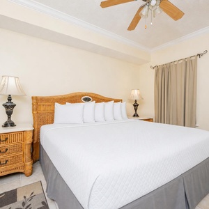 Retreat to this tranquil king master suite, where soft bedding invites restful nights after days of seaside adventures