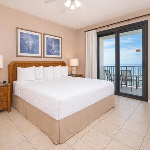 Experience serene mornings in the king master suite, with shimmering coastal views inviting you to relax and unwind