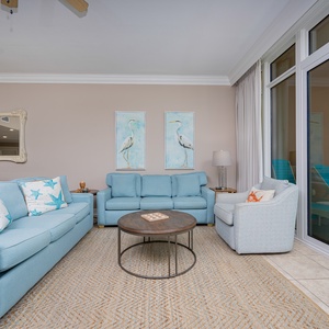 Breathe in the coastal breeze as you relax on the spacious sofa, enveloped in comfort and vibrant decor
