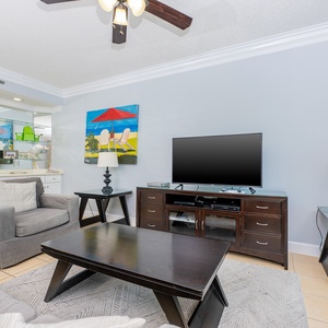 Kick back in the inviting family room, surrounded by coastal decor while catching your favorite shows
