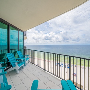 Relax on the turquoise chairs of your balcony, savoring views of the beach and gentle waves below