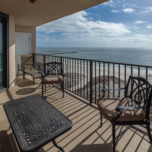 Enjoy stunning views of the water and gentle waves lapping at the shore from your balcony