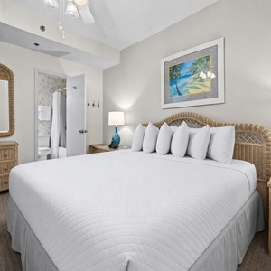 Drift into serene comfort in the king suite, surrounded by beach decor evoking peaceful seaside vibes