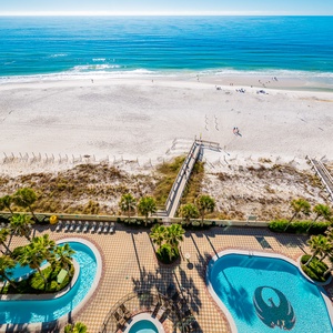 Discover the refreshing pool area with gradual entry, indoor hot tubs and pool, lazy river, and waterslide