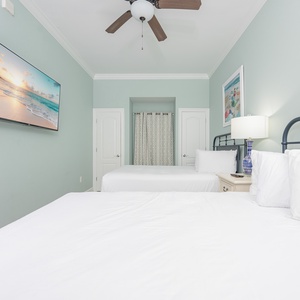 Unwind in this queen guest suite and stream your favorite shows or enjoy a good movie after a beach day