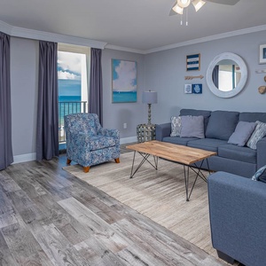 Relax in the inviting living area, featuring a queen sleeper sofa and stunning beachfront views