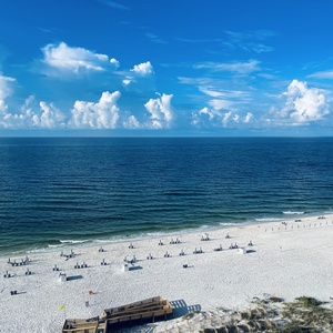 Picture yourself on the balcony, feeling the gulf breeze as waves roll toward the beach
