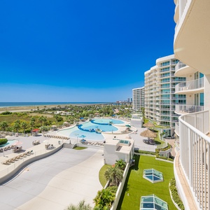 Experience breathtaking views of the pool area and lush greenery from the spacious balcony of this inviting vacation rental