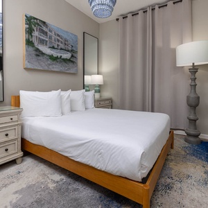 Sleep peacefully in this inviting guest bedroom featuring a plush queen bed, stylish decor, and a cozy atmosphere