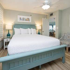 Relax in this inviting guest bedroom featuring a queen bed, stylish decor, and a charming seating area