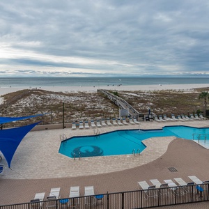 Take a refreshing dip in the pool while enjoying views of the beach and inviting lounge areas nearby