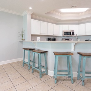 Enjoy a casual breakfast at the charming bar stools, connecting with family over fresh coffee and morning treats