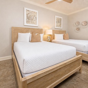 Snuggle into the plush queen beds, perfect for restful nights after beach adventures, surrounded by serene decor