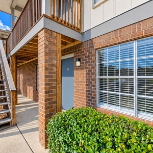 Lush greenery surrounds the property, creating a beautiful atmosphere