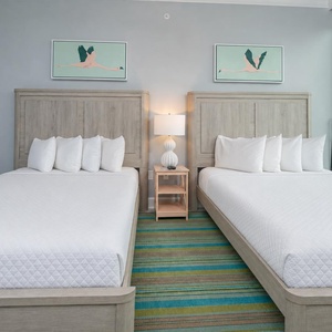 Sleep peacefully surrounded by coastal scenes in this queen suite for a cozy retreat