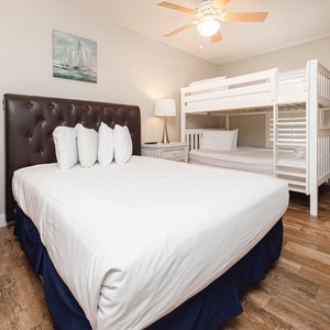 Rest comfortably in thie guest room featuring a queen bed, cozy queen bunk bed, and tasteful decor for a relaxing stay