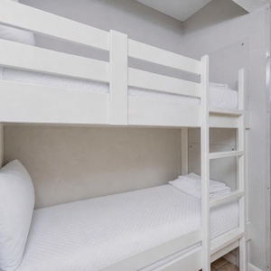 Cozy bunk area in the hallway for kids to enjoy relaxing after a day of adventure