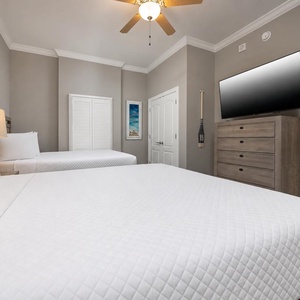 Unwind in this queen guest suite and stream your favorite shows or enjoy a good movie after a beach day