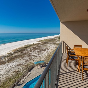 Savor meals at the outdoor table while enjoying the expansive views of the water and beach just steps away