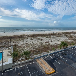 Enjoy a breathtaking view from this inviting poolside area, perfect for relaxation and sunbathing