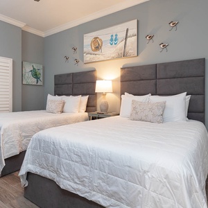 Settle into the roomy queen beds under tall upholstered headboards and read by the bedside lamp in the guest room