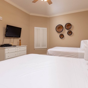 Unwind in this queen guest suite and stream your favorite shows or enjoy a good movie after a beach day