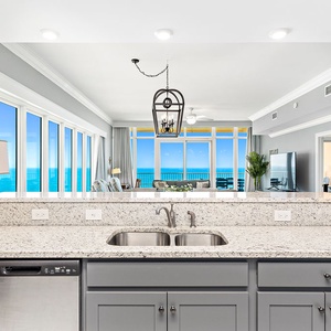 Enjoy preparing meals in this kitchen with stunning views from the balcony
