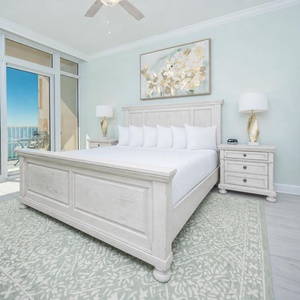 Relax the king master suite with cozy bedding and drift off to the sound of the waves from the balcony