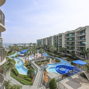 Discover the pool area with a refreshing lazy river and thrilling waterslide, just steps from the bay