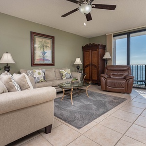 Unwind in the inviting living area featuring plush seating, sofa with queen sleeper, and stunning beach views