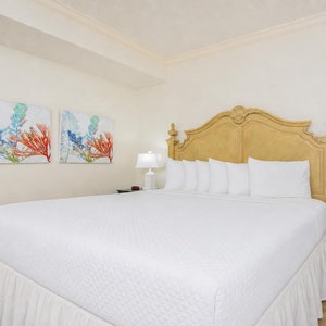 Drift into peaceful slumber on the plush king bed, surrounded by calming decor in this guest suite