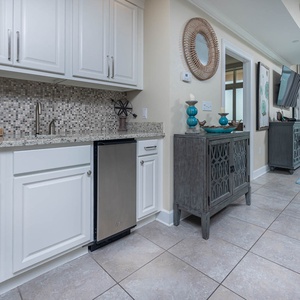Prepare drinks at the stylish wet bar with an ice maker and decorative accents for a welcoming vibe