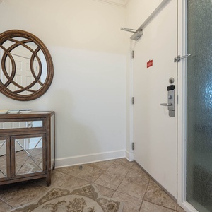 Welcome to your entryway featuring a stylish console table, a decorative mirror, and a cozy area rug for a warm greeting